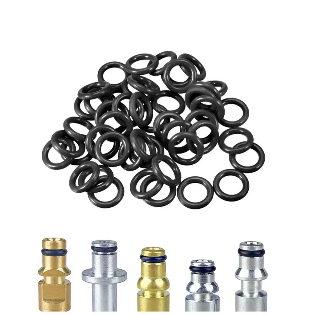Pile of rubber O-rings above brass and aluminium connector fittings on a plain background