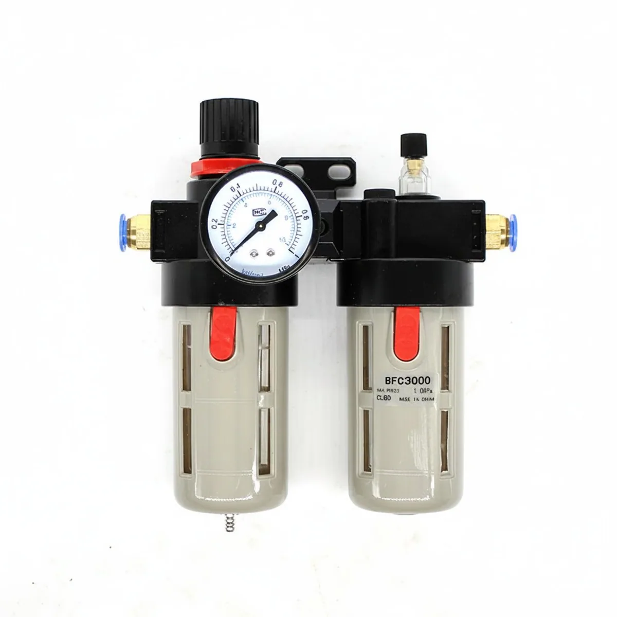 BFR3000+BL3000 G3/8 air compressor oil-water separator and filter regulator unit for pneumatic systems, shown on a clean workbench.