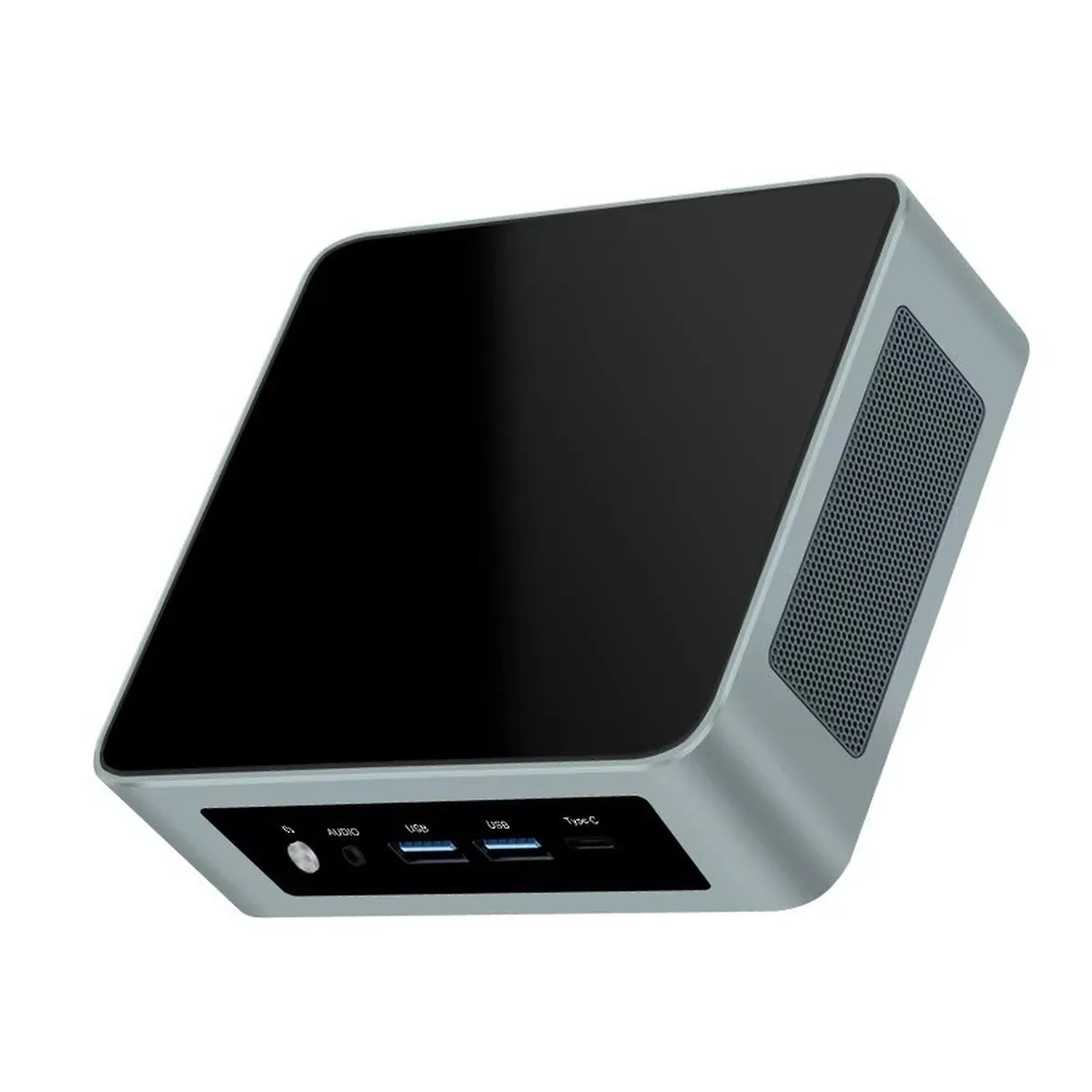 Angled view of a Ryzen Mini PC showing front USB ports, audio jack, and side ventilation.